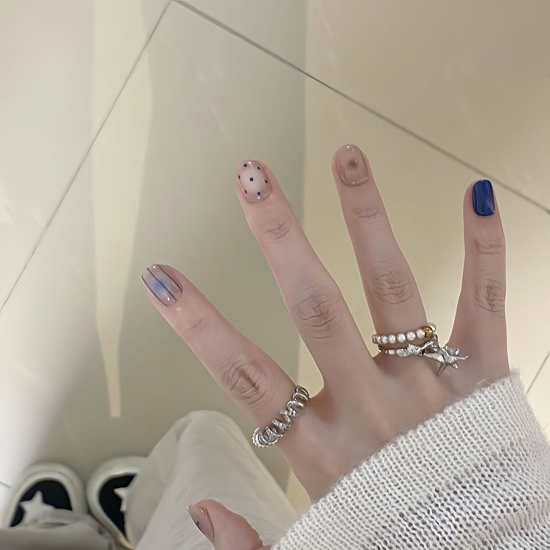 Artificial nails in modern design with geometric and sparkling accents Kalsten