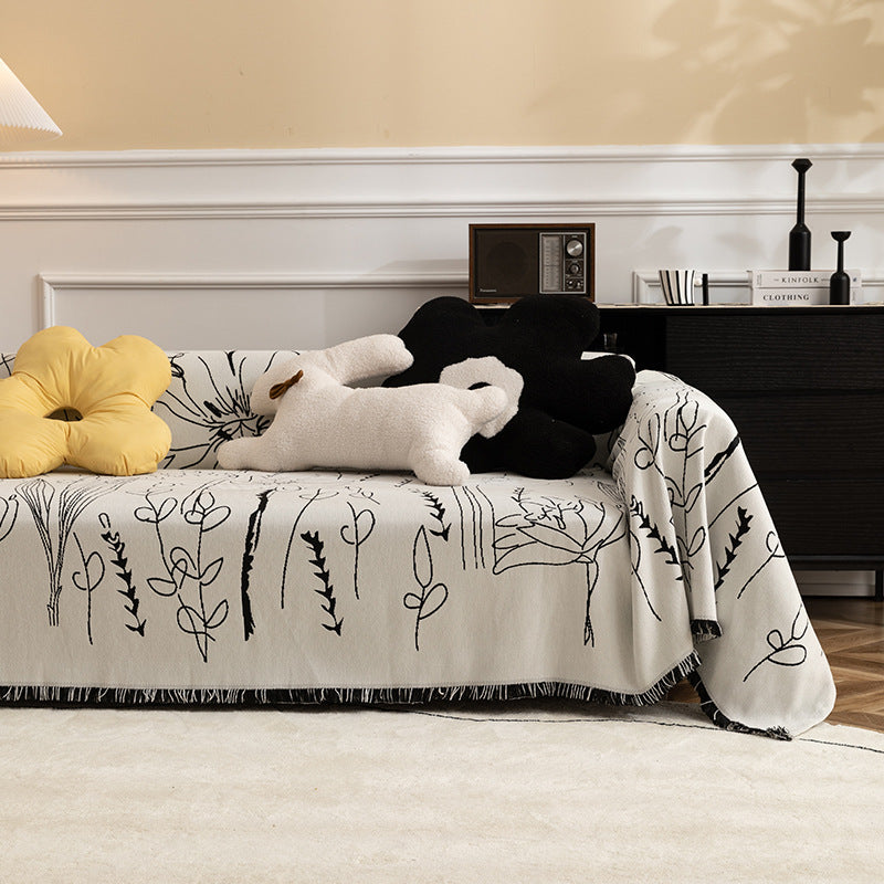 Fine woven sofa cover and furniture throw with floral line drawing and decorative fringed edge Kalsten