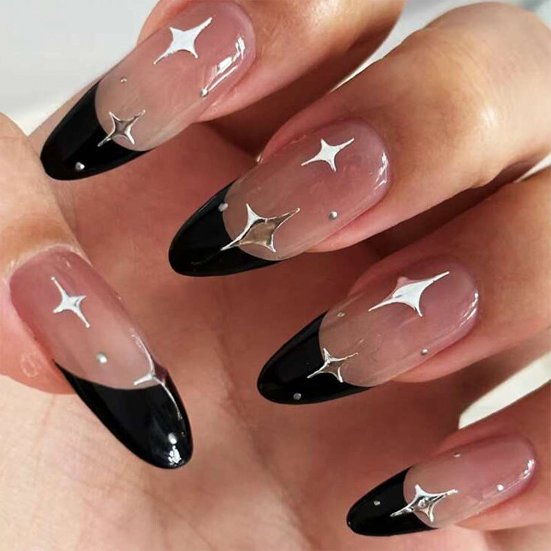 Artful stiletto nails with heart-shaped accents Kalsten