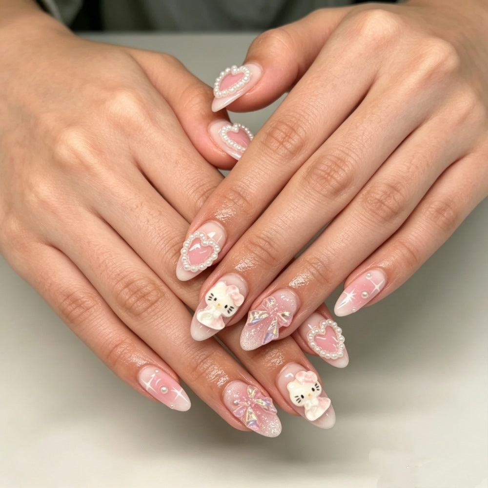 Playful artificial nails with heart and kitty motifs Kalsten