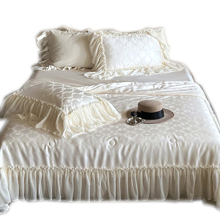 Elegant satin bed linen set with generous ruffle trim and tone-on-tone jacquard pattern