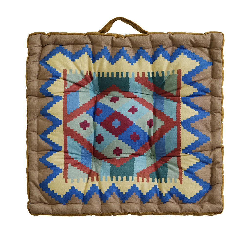 Padded seat and floor cushion with carrying handle and graphic ethno pattern Kalsten