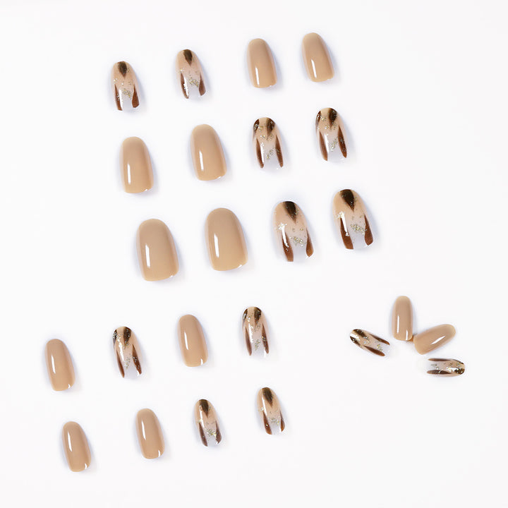 Artificial nail extensions with modern design and glitter accents Kalsten