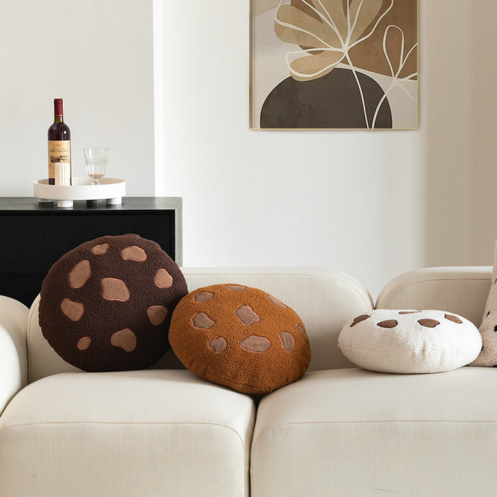 Round cuddle seat cushion with teddy fleece and abstract patch appliqués Kalsten