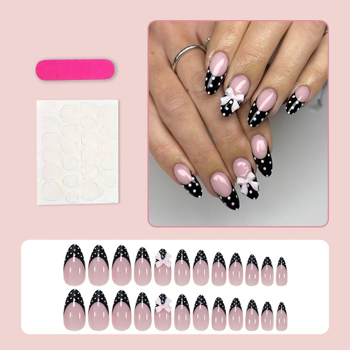 Artificial nail set with glamorous black and white polka dot accents Kalsten
