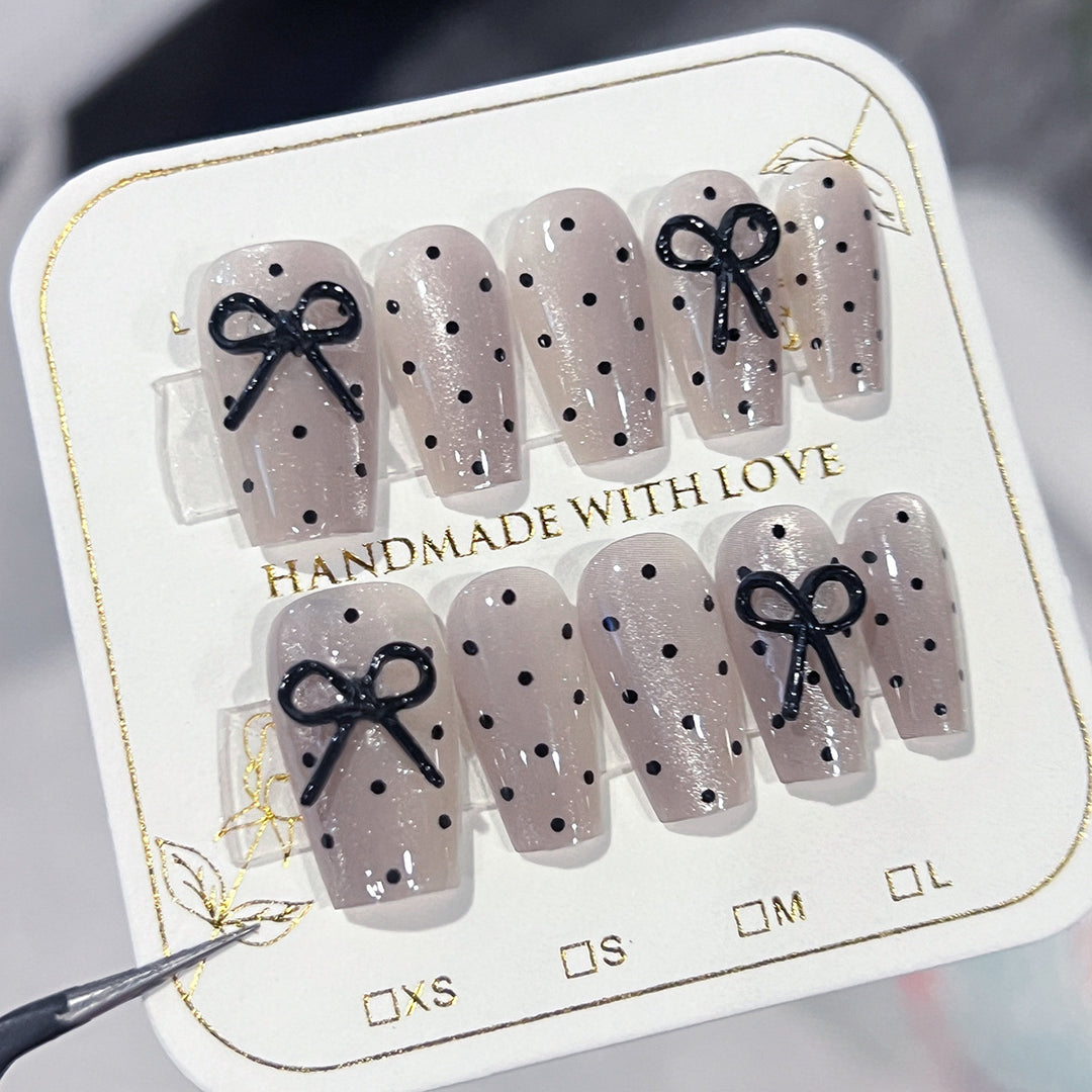 Artful Nail Extensions with Bow Pattern Kalsten