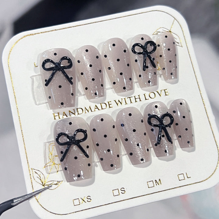 Artful Nail Extensions with Bow Pattern Kalsten
