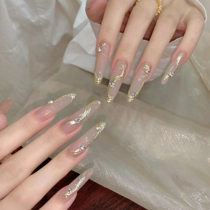 Artificial nail set with elegant gold design and sparkling applications Kalsten