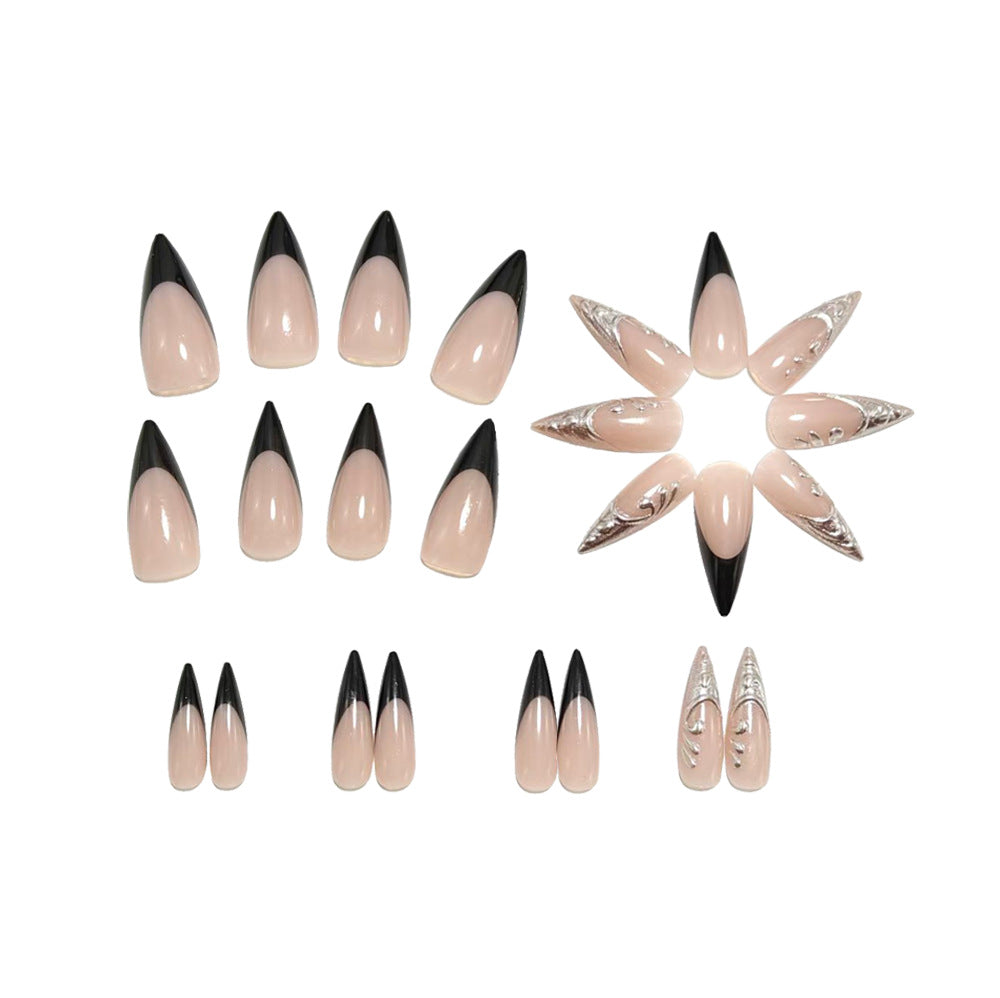 Artificial nails in elegant stiletto style with elaborate metal decoration Kalsten