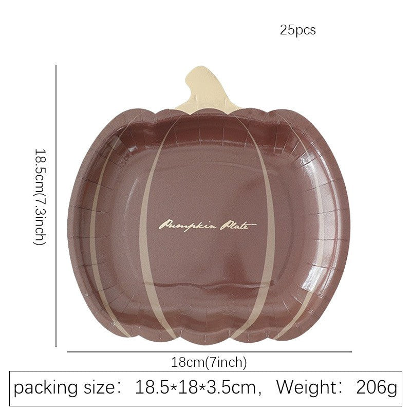Disposable paper plates in pumpkin shape with spooky face design