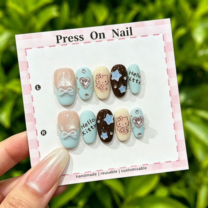 Artistic Press-On Nail Art Set with Cute Character and Bow Accents
