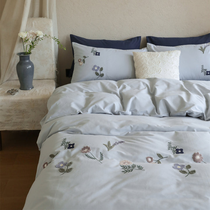 Embroidered cotton bedding set with delicate wildflower embroidery and percale texture
