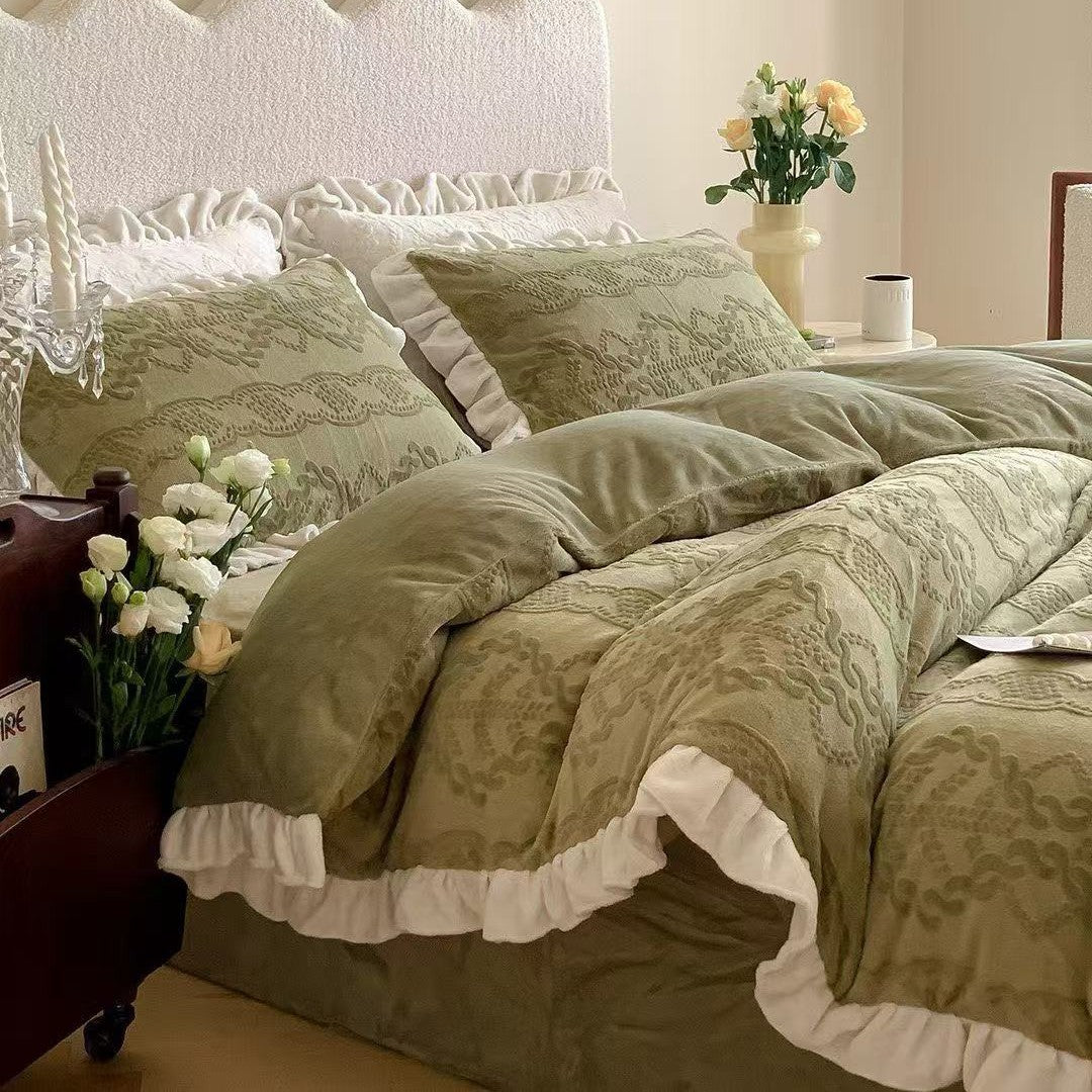 Quilted bedding set with ruffled hem and tone-on-tone embroidery