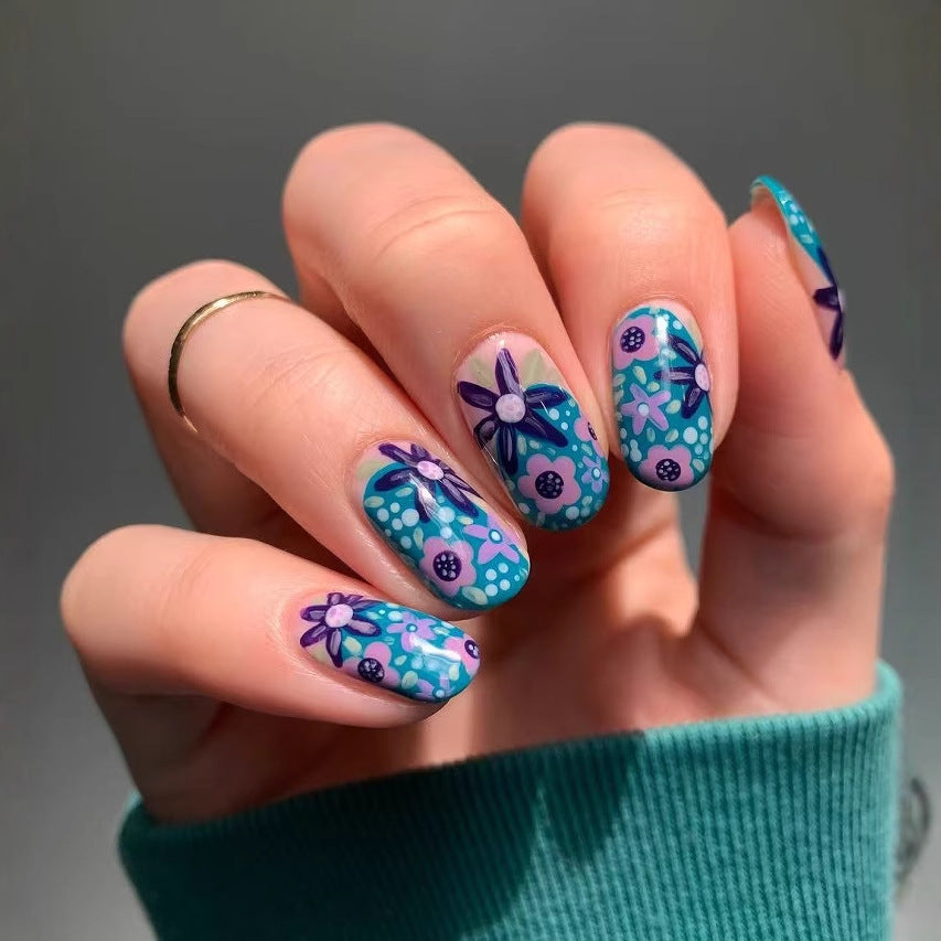 Nail art set with floral accents and vibrant patterns Kalsten