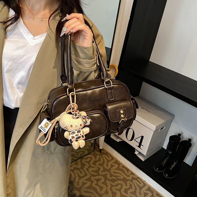 Elegant Handbag with Playful Charms and Multiple Compartments Kalsten
