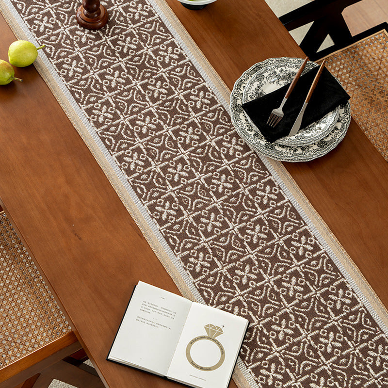 Decorative table runner with woven ornament jacquard and finely hemmed edges Kalsten