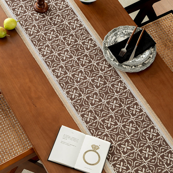 Decorative table runner with woven ornament jacquard and finely hemmed edges Kalsten