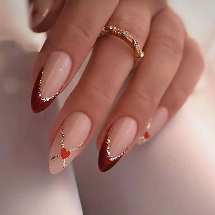 Acrylic nails with heart motifs and glitter details Kalsten
