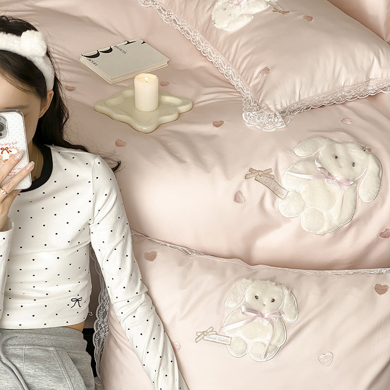 Luxurious satin bedding set with plush bunny appliqué and lace trim