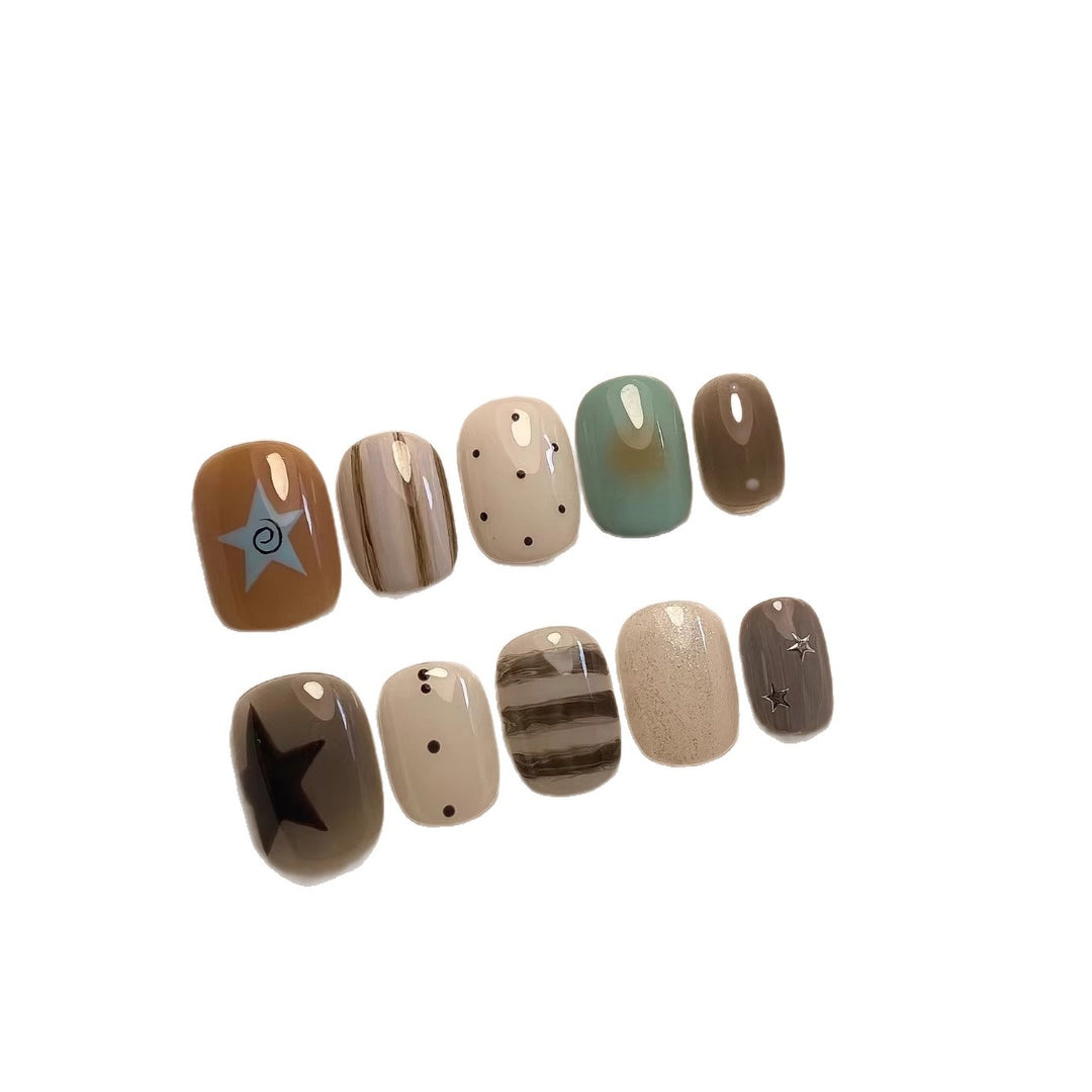Artistic Press-On Nail Set with Abstract Patterns and Decorative Elements