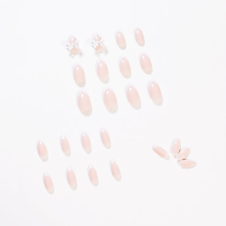 Elegant artificial nails with translucent French tip and decorative floral accents Kalsten
