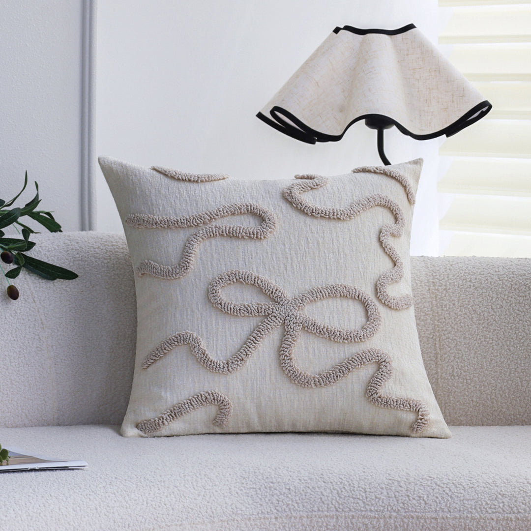 Square decorative cushion cover with hand-tufted bow and wave relief made of cotton-linen mix Kalsten