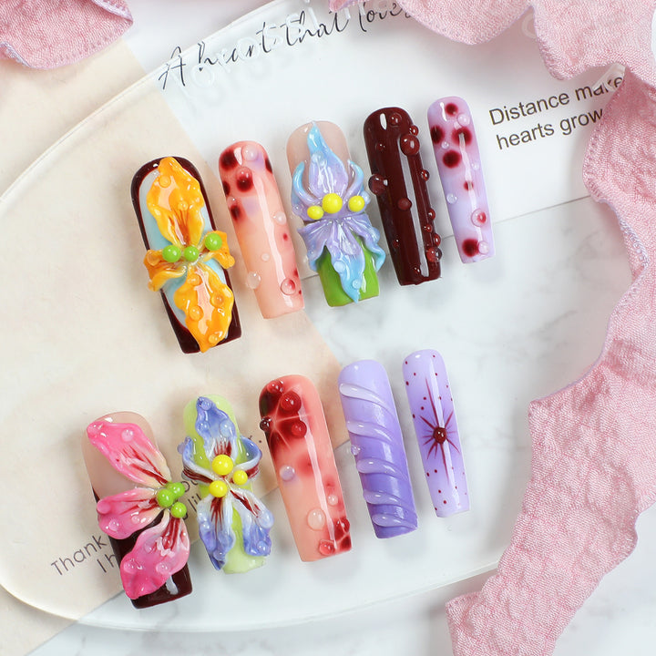 Creative artificial nail set with elegant floral design and glitter accents Kalsten