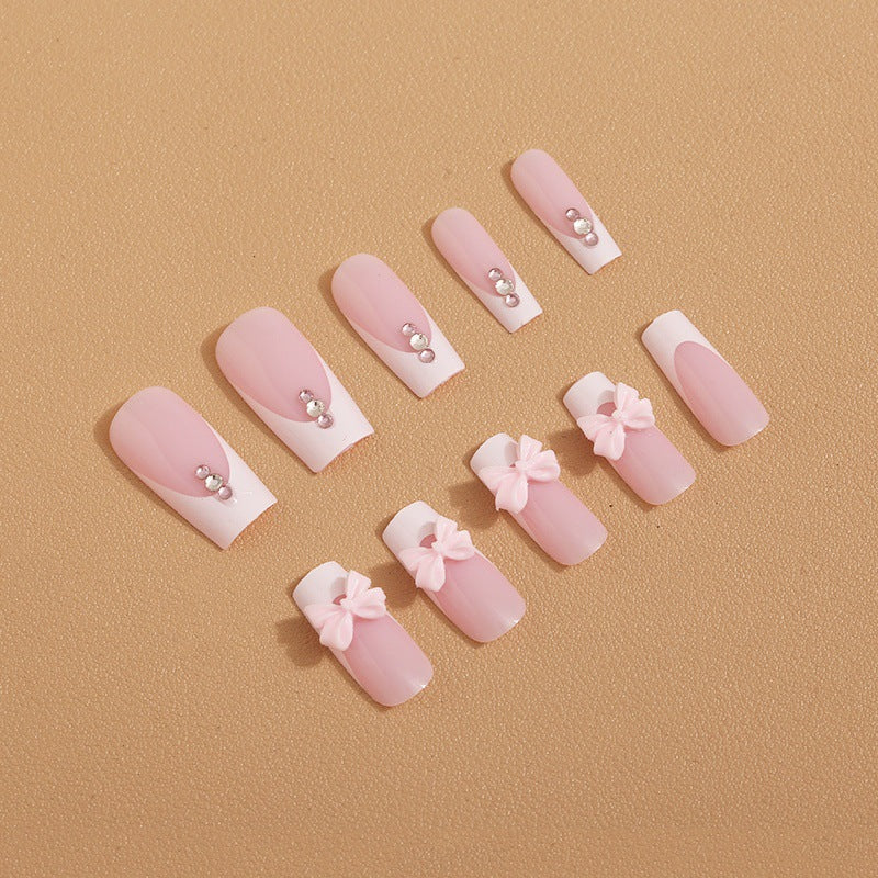 Trendy French-design artificial nails with bow accents Kalsten