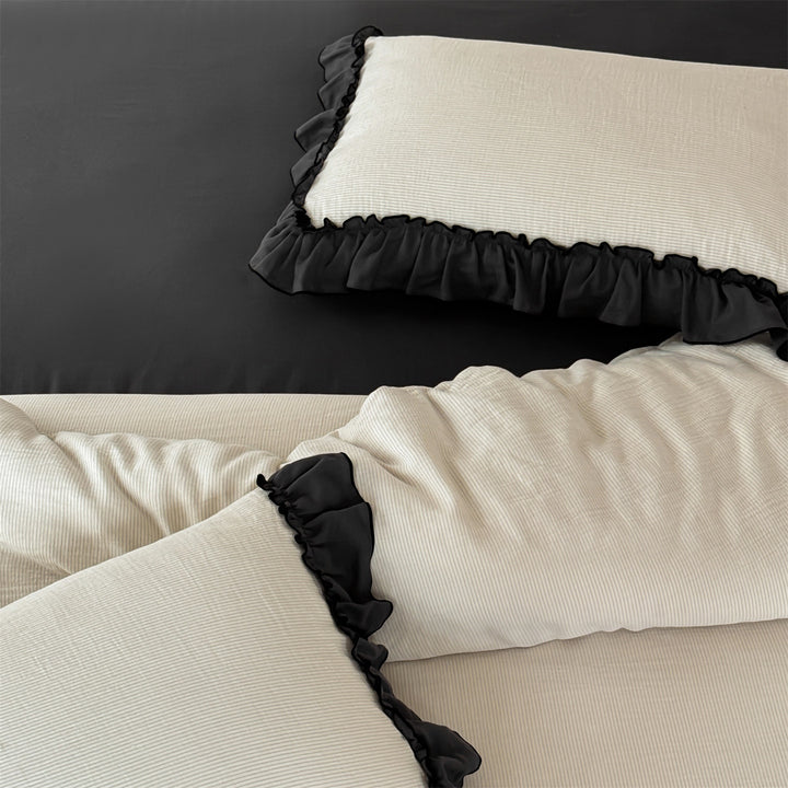 Bedding set with decorative ruffle trim and fine cotton texture