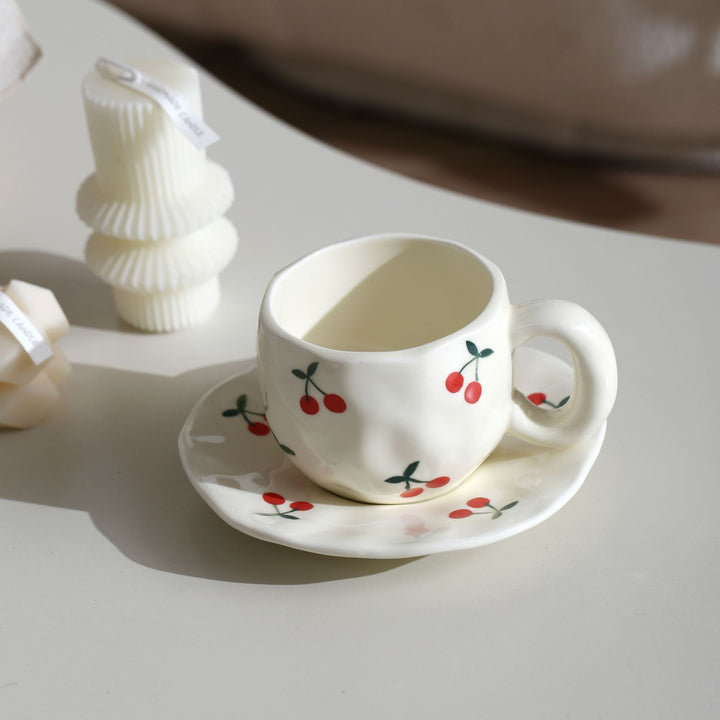 Ceramic mug with hand-painted tulip pattern and organic shape