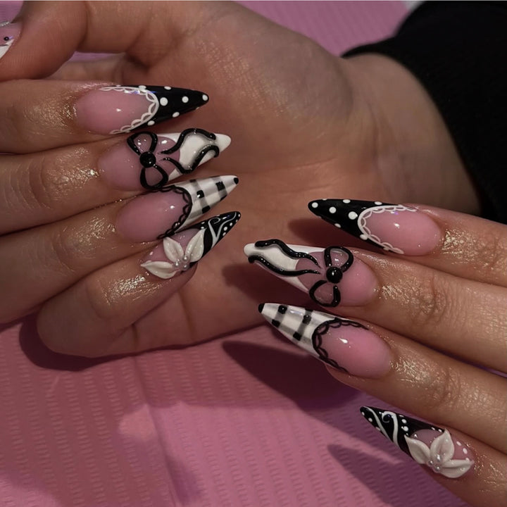 Artful stiletto nails with floral and geometric accents Kalsten