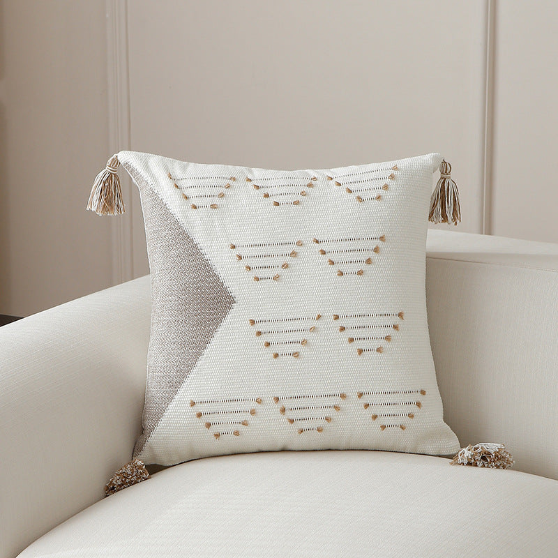 Decorative woven cushion cover with geometric tuft-relief and tassels Kalsten
