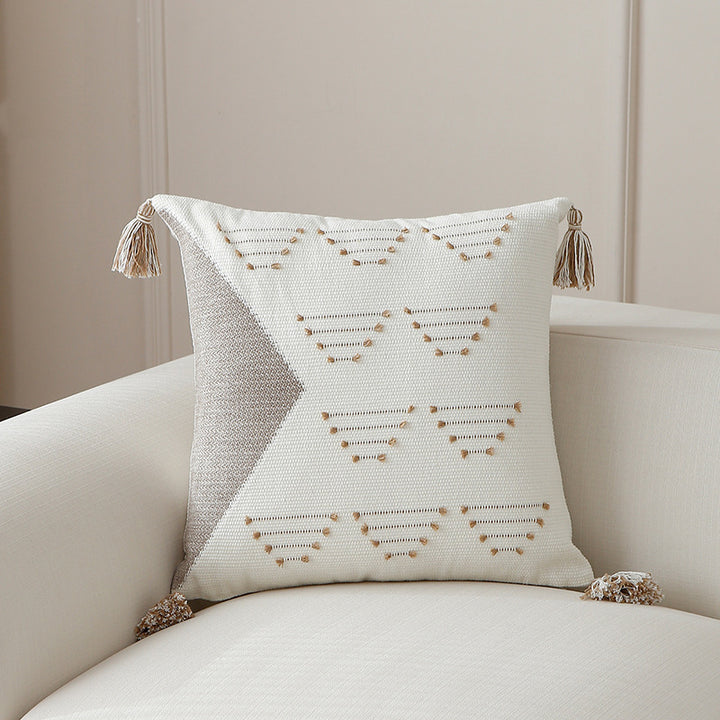 Decorative woven cushion cover with geometric tuft-relief and tassels Kalsten