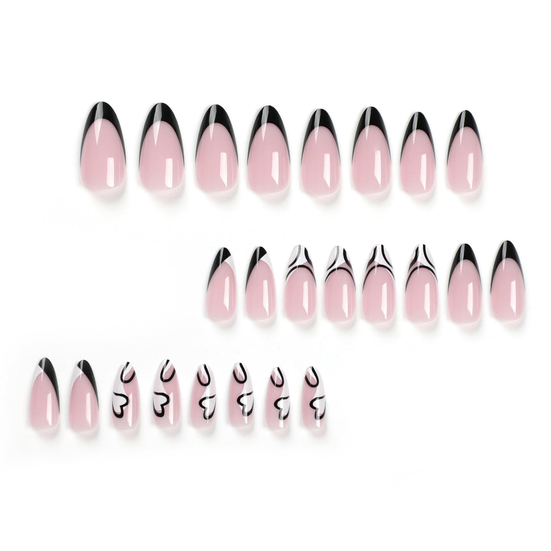 Artful stiletto nails with elegant black-and-white design Kalsten