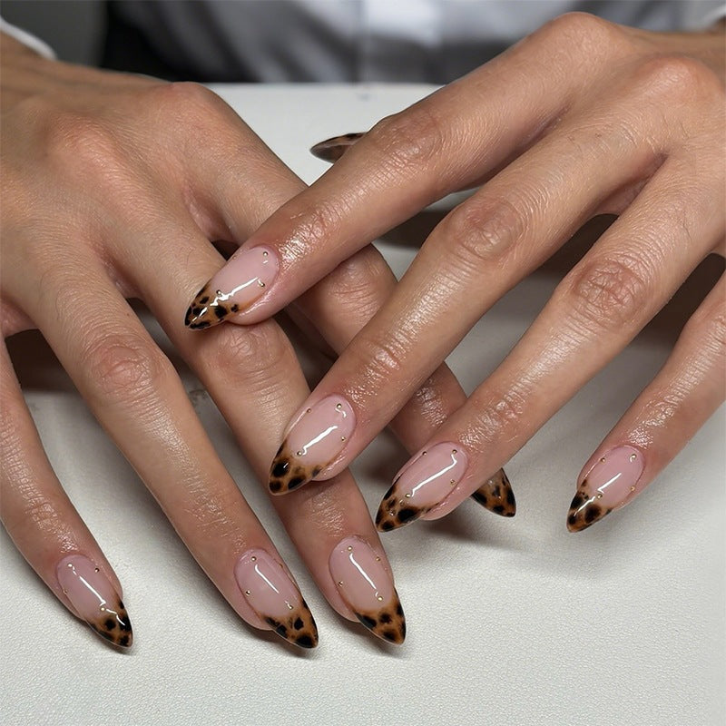 Acrylic nail set with elegant leopard design and gold accents Kalsten