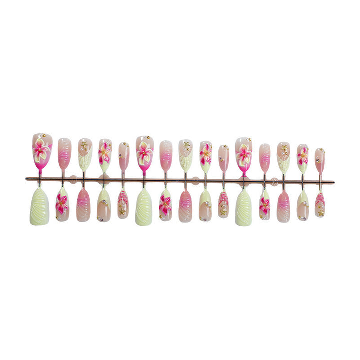 Creative acrylic nail set with floral accents and glitter decorations Kalsten