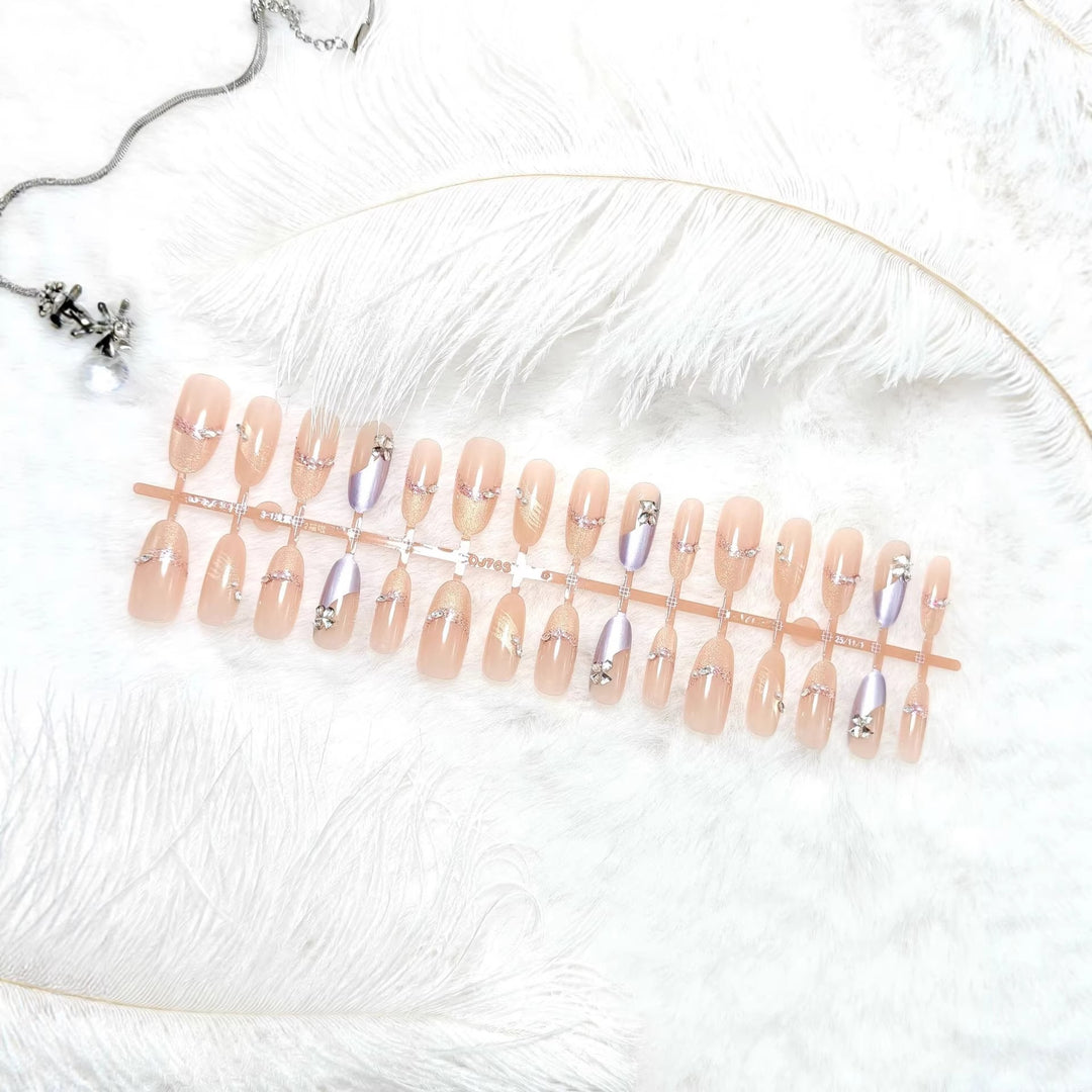 Artificial nails with modern glitter and stone embellishments Kalsten