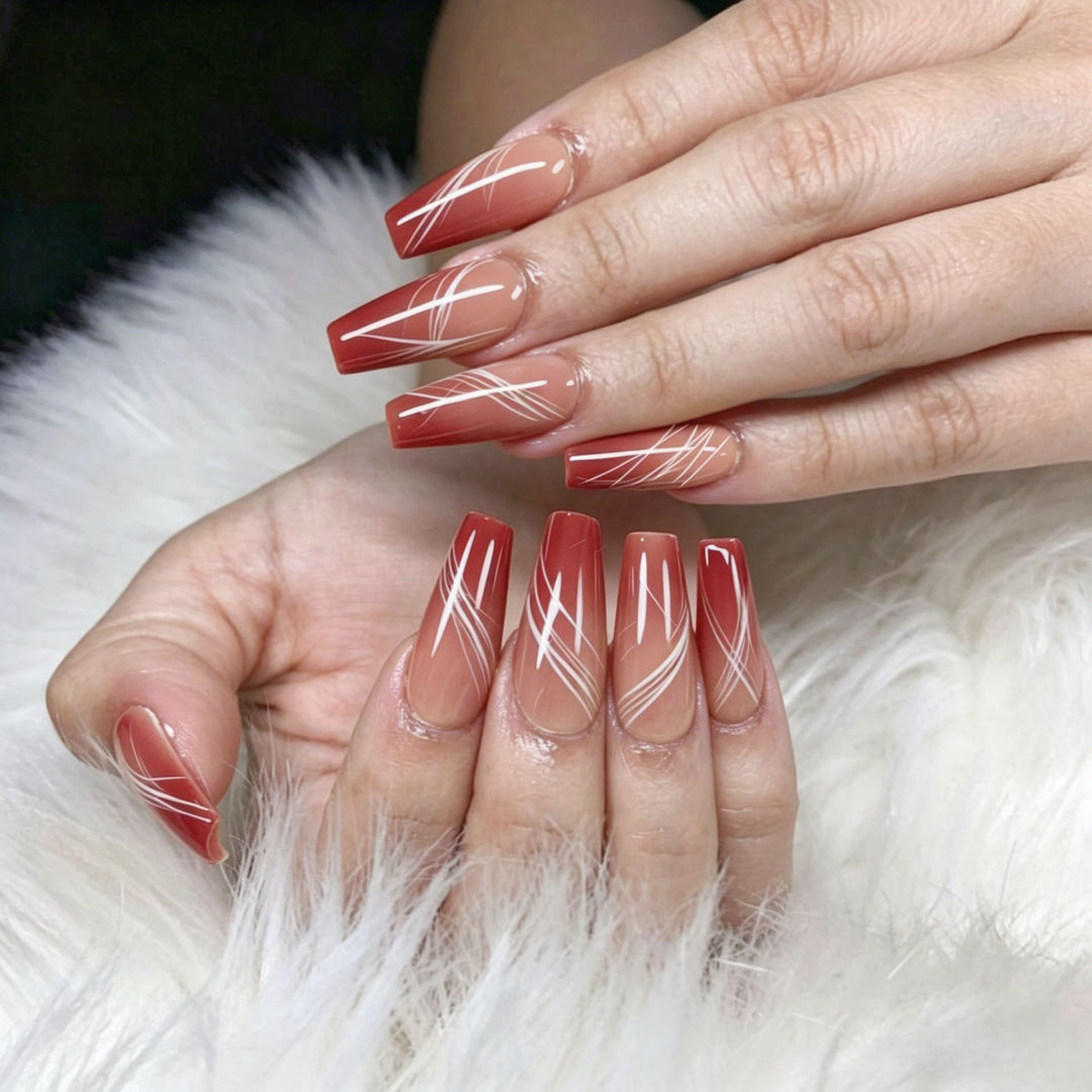 Artificial nails in elegant ombre design with fine lines Kalsten