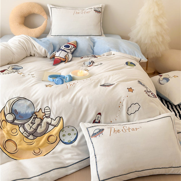 Child bedding set made of soft cotton blend with embroidered astronaut and rocket motif