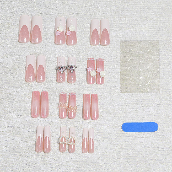 Artful nail tips with pearl and bow motifs Kalsten