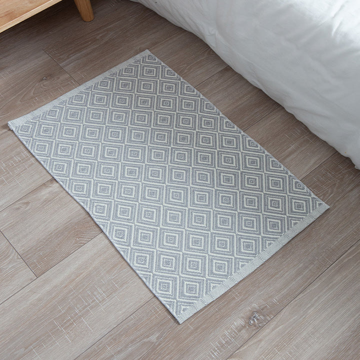 Striped cotton doormat with non-slip bottom and decorative woven edge Kalsten