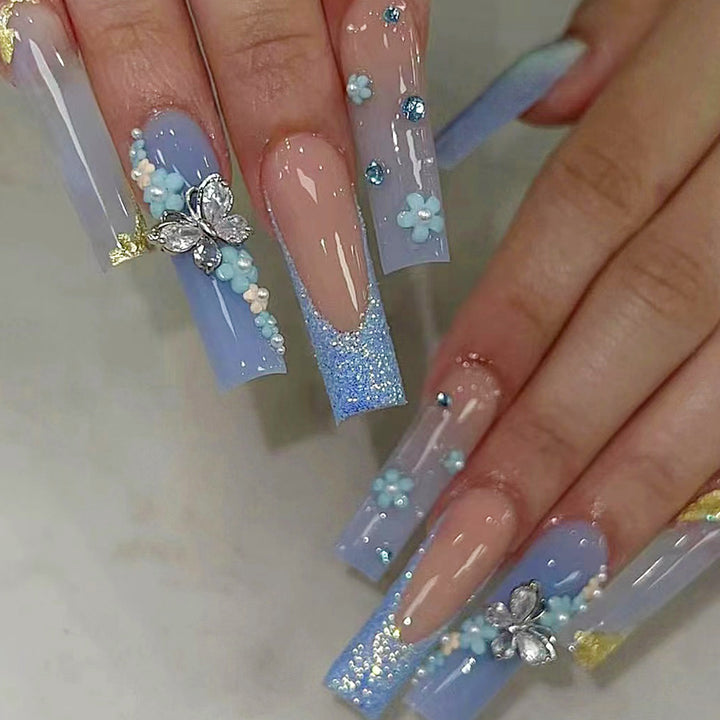 Artistic acrylic nails with flower and glitter design Kalsten