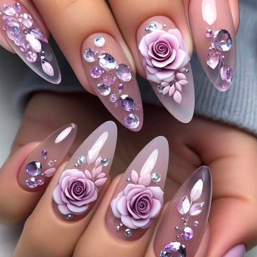 Creative nail art set with elegant rose accents and soft color gradient Kalsten