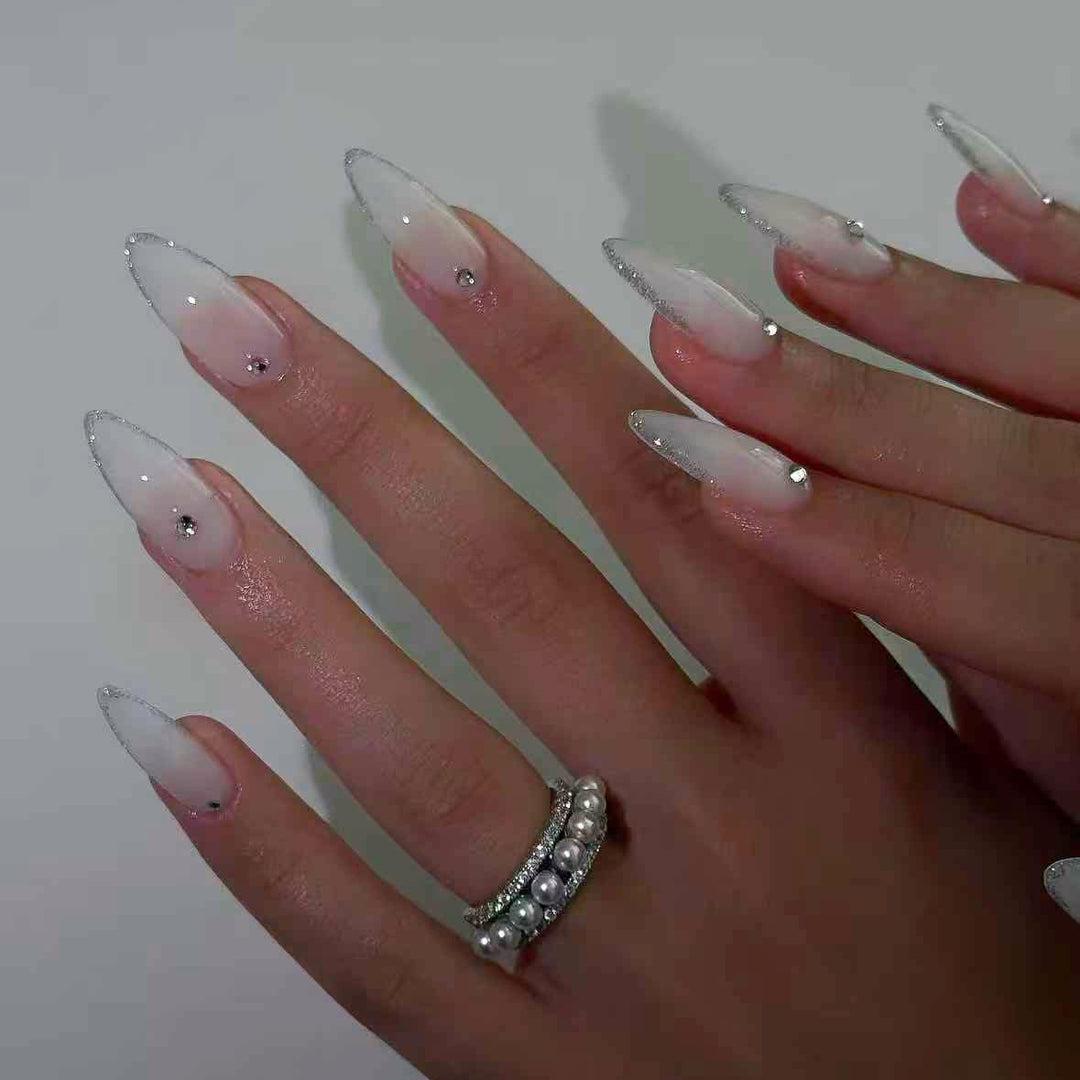 Acrylic nail set with elegant tips and sparkling accents Kalsten