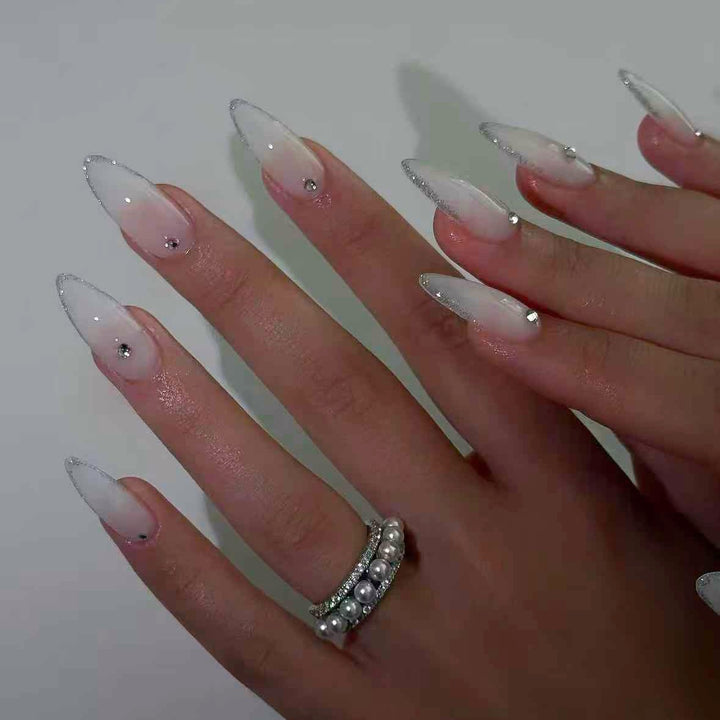 Acrylic nail set with elegant tips and sparkling accents Kalsten