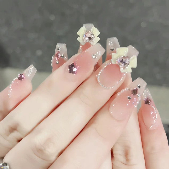 Glamorous artificial nails with moon and star motifs Kalsten