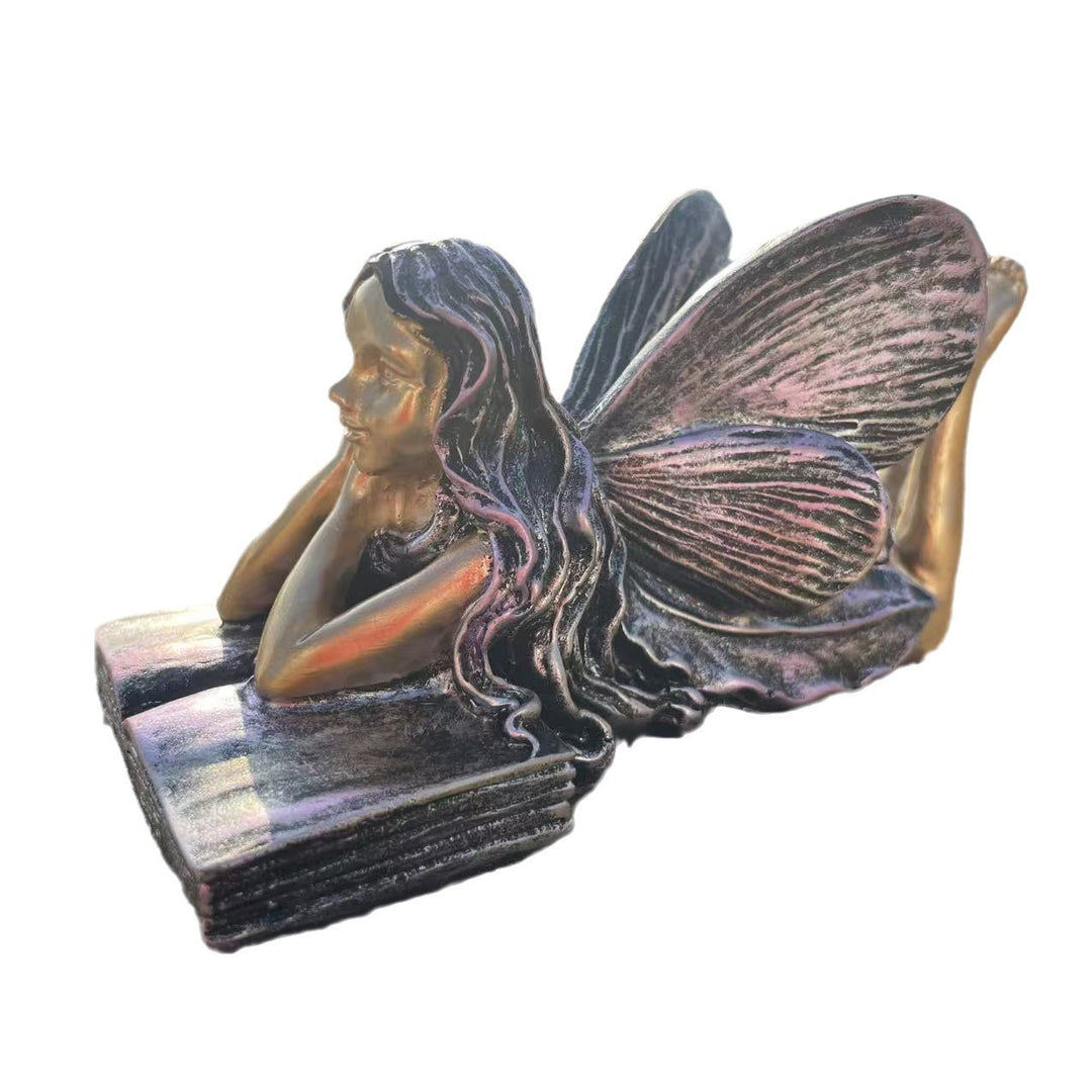 Fairy Figurine Sitting on Books Kalsten