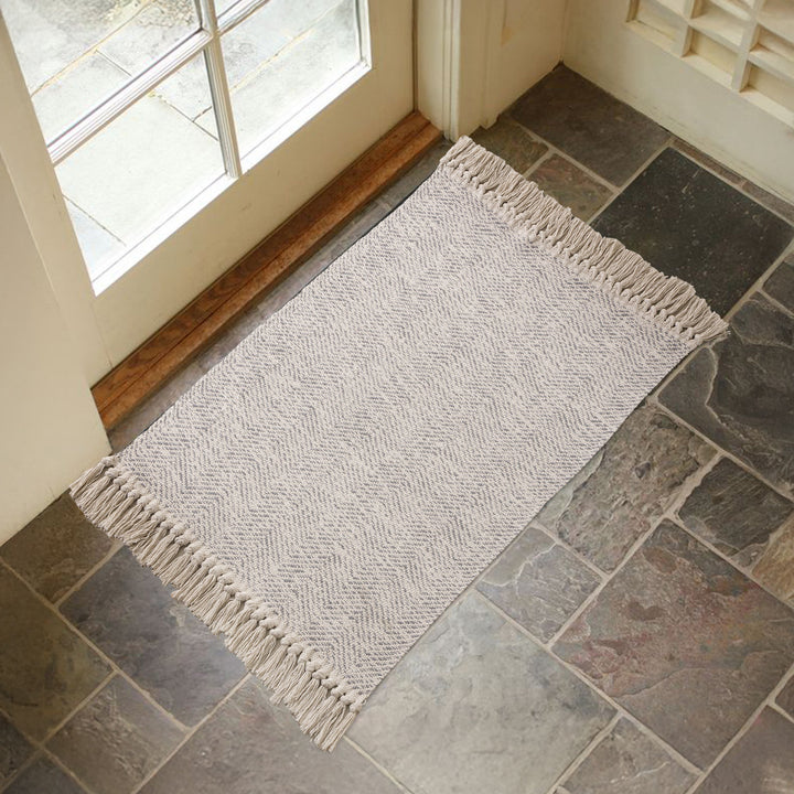 Braided runner rug with herringbone pattern and fringe edge Kalsten