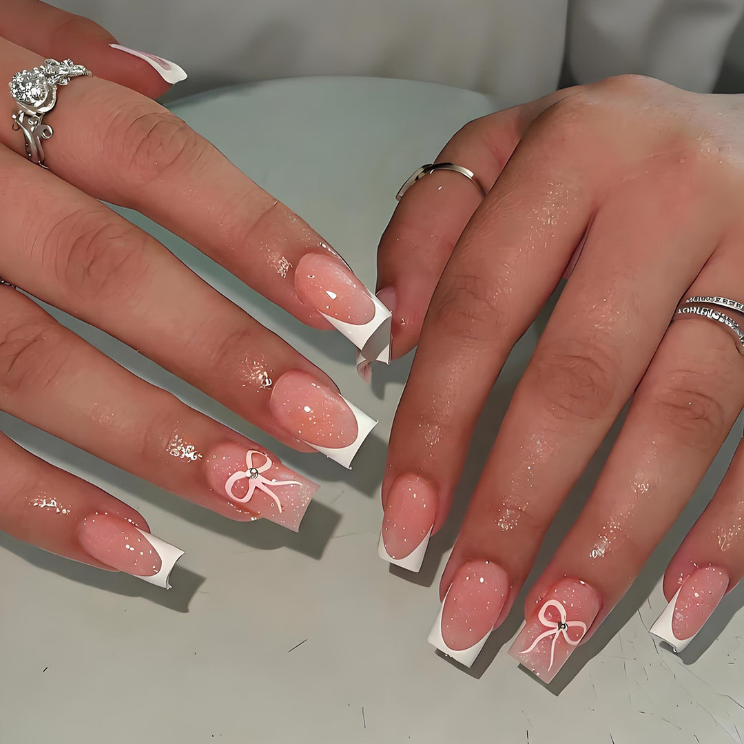 Artificial nail set with elegant tips and delicate bow motifs Kalsten