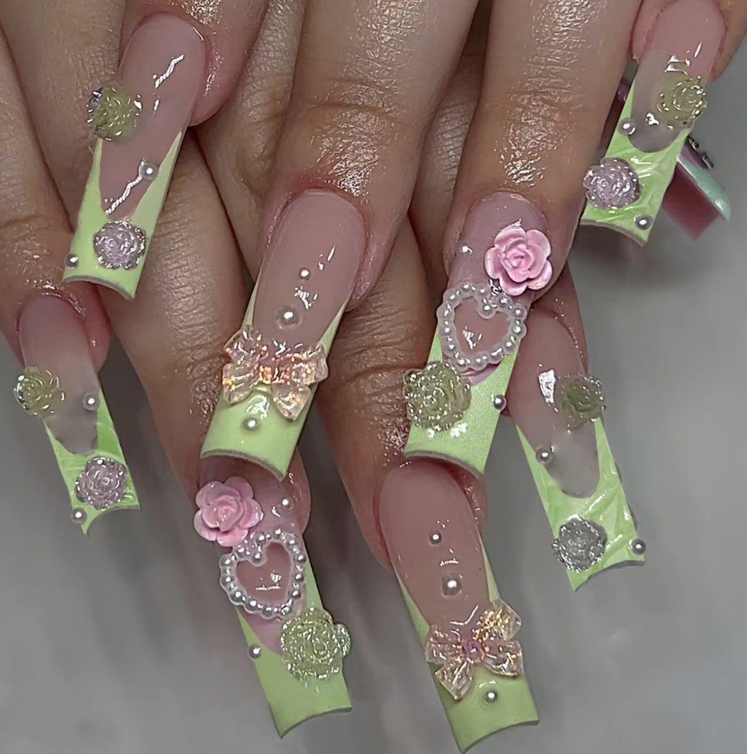 Artful artificial nails with floral and decorative accents Kalsten